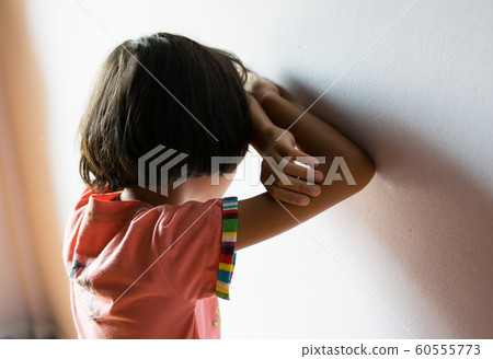 sad children,girl standing at room 60555773