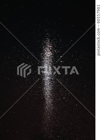 Explosion of golden sparkling flying sparkles on a black holiday background. Abstract festive background for holidays, promotions and sales. Minimalism Explosion of golden sparkling flying sparkles on a black holiday background. Abstract festive background for holidays, promotions and sales. Minimalism 60557981