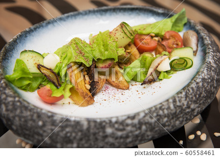 Salad with fried potato 60558461