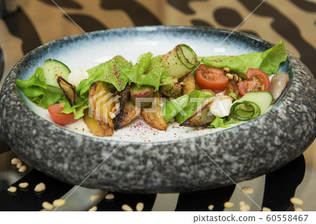 Salad with fried potato 60558467