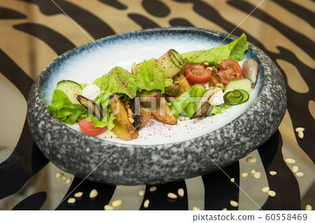Salad with fried potato 60558469