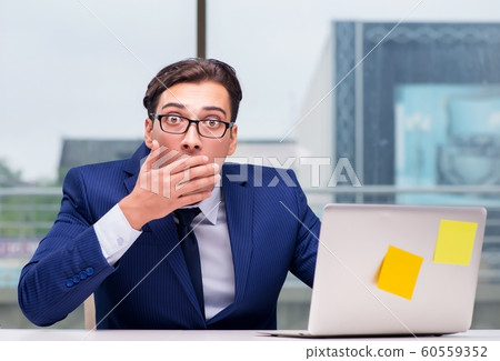 Workaholic businessman overworked with too much work in office Workaholic businessman overworked with too much work in office 60559352