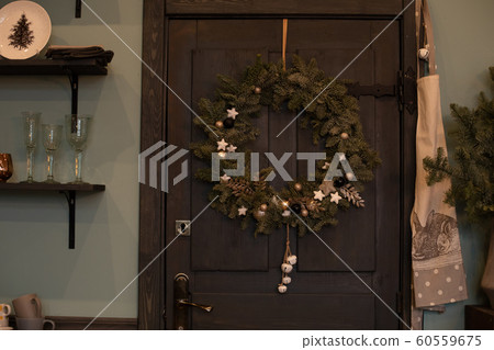 Christmas wreath on the front door. Christmas and 60559675