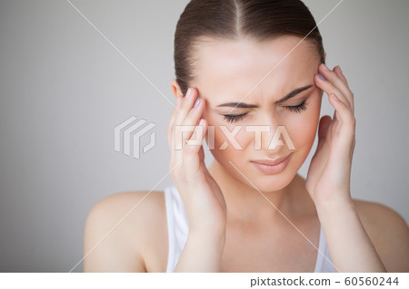 Health and Head Pain. Beautiful Woman Having Strong Headache, Feeling Pain 60560244