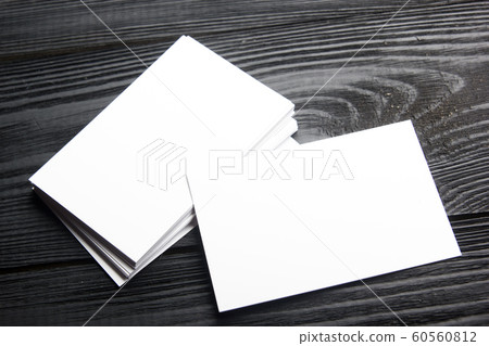 Business card blank on wooden background. Corporate Stationery, Branding Mock-up. Creative designer desk. Flat lay. Copy space for text 60560812