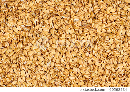 Oat flakes background. Oat flakes background. 60562384