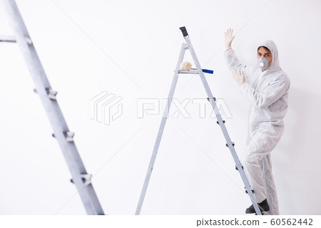 Painter working at construction site Painter working at construction site 60562442