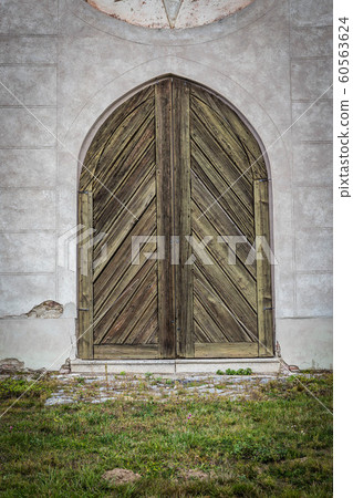 Ancient wooden door in old stone castle wall. Czech republic 60563624