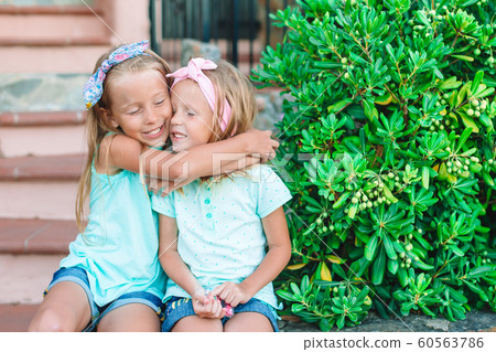 Pretty smiling little girls with shopping bags Pretty smiling little girls with shopping bags 60563786