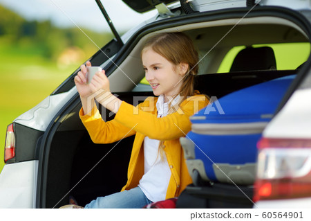 Adorable little girl ready to go on vacations with Adorable little girl ready to go on vacations with 60564901