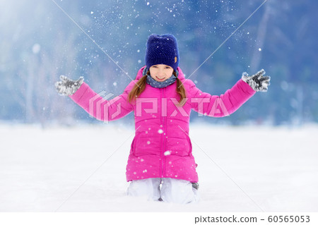 Adorable little girl having fun in beautiful Adorable little girl having fun in beautiful 60565053
