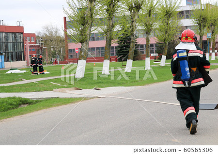 Professional firefighters, rescuers in  60565306