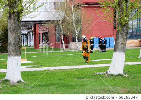 Professional firefighters, rescuers in  60565347