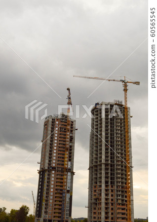 two buildings and two building cranes, two buildings and two building cranes, 60565545