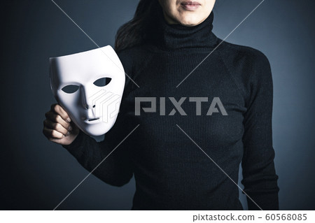 Woman in white mask and black clothes Woman in white mask and black clothes 60568085