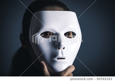 Woman in white mask and black clothes 60568163
