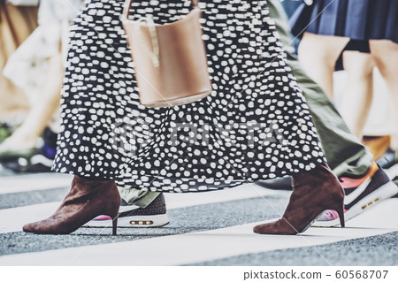 People crossing a pedestrian crossing 60568707