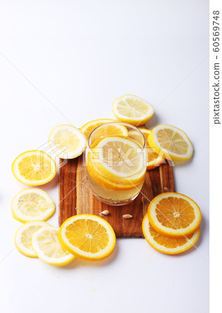 drink and stack of citrus fruits slices. drink and stack of citrus fruits slices. 60569748