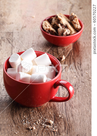 marshmallows and cookies in red cup marshmallows and cookies in red cup 60570227