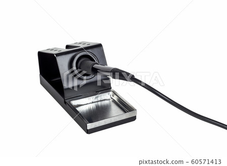 Electric soldering iron on a stand. Electric soldering iron on a stand. 60571413