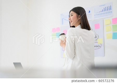 Portrait of beautiful young asian business woman working in office room 60572276