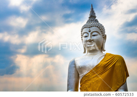 A beautiful old white Buddha statue amidst the A beautiful old white Buddha statue amidst the 60572533