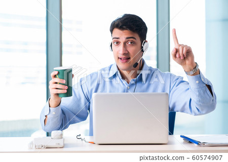 Male call-center operator in business concept Male call-center operator in business concept 60574907