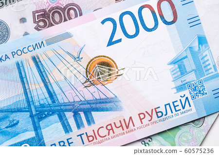 Russian ruble. Russian currency closeup in the form of texture. Russian ruble. Russian currency closeup in the form of texture. 60575236