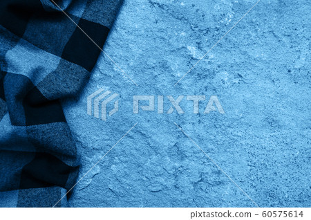 Checkered napkin on a stone background toned 60575614