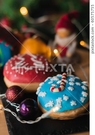 Christmas cakes on the table with tangerines 60575755