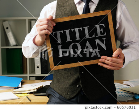 Title Loan inscription in the hands of a man. Title Loan inscription in the hands of a man. 60576031