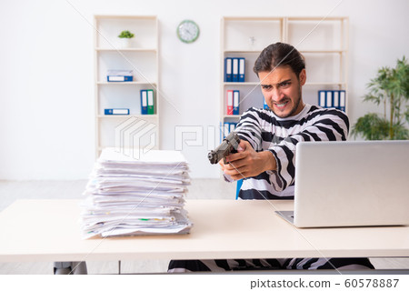 Young employee feeling like prisoner at work 60578887
