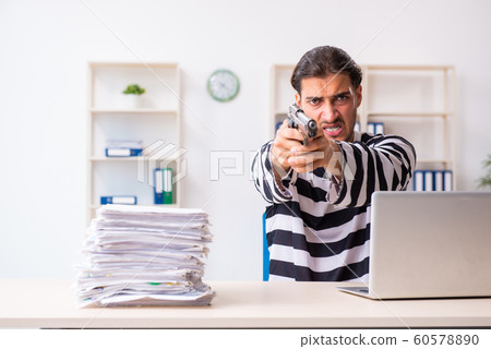 Young employee feeling like prisoner at work 60578890
