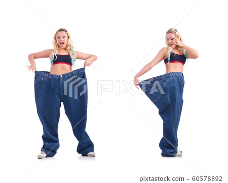 Woman in dieting concept with big jeans Woman in dieting concept with big jeans 60578892
