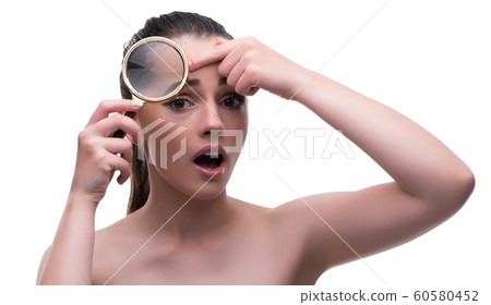 Woman in beauty concept with magnifying glass aging wrinkles 60580452
