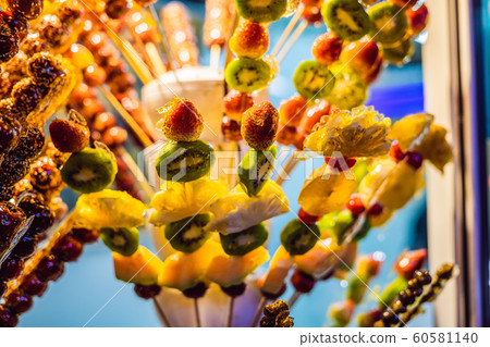 Traditional Chinese Dessert - Candied Fruit on a Wooden Stick Traditional Chinese Dessert - Candied Fruit on a Wooden Stick 60581140