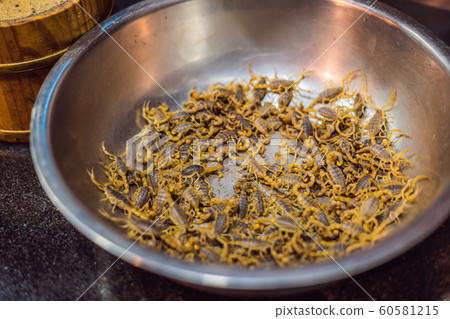 Fried scorpions in Wangfujing night market of Beijing, China 60581215
