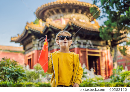 Enjoying vacation in China. Young boy with national chinese flag in Forbidden City. Travel to China with kids concept. Visa free transit 72 hours, 144 hours in China 60582130