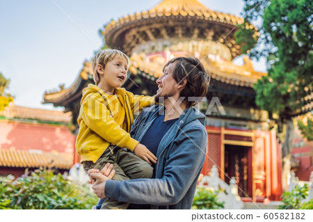 Enjoying vacation in China. Dad and son in Forbidden City. Travel to China with kids concept. Visa free transit 72 hours, 144 hours in China Enjoying vacation in China. Dad and son in Forbidden City. Travel to China with kids concept. Visa free transit 72 hours, 144 hours in China 60582182