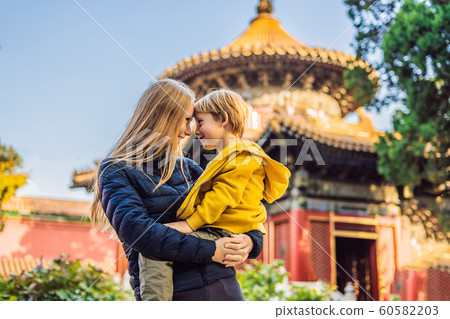 Enjoying vacation in China. Mom and son in Forbidden City. Travel to China with kids concept. Visa free transit 72 hours, 144 hours in China Enjoying vacation in China. Mom and son in Forbidden City. Travel to China with kids concept. Visa free transit 72 hours, 144 hours in China 60582203