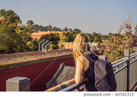 Enjoying vacation in China. Young woman in Forbidden City. Travel to China concept. Visa free transit 72 hours, 144 hours in China Enjoying vacation in China. Young woman in Forbidden City. Travel to China concept. Visa free transit 72 hours, 144 hours in China 60582313
