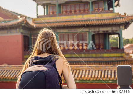 Enjoying vacation in China. Young woman in Forbidden City. Travel to China concept. Visa free transit 72 hours, 144 hours in China 60582316