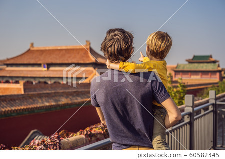 Enjoying vacation in China. Dad and son in Forbidden City. Travel to China with kids concept. Visa free transit 72 hours, 144 hours in China Enjoying vacation in China. Dad and son in Forbidden City. Travel to China with kids concept. Visa free transit 72 hours, 144 hours in China 60582345