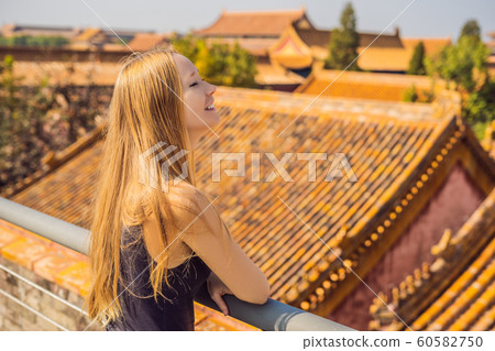 Enjoying vacation in China. Young woman in Forbidden City. Travel to China concept. Visa free transit 72 hours, 144 hours in China 60582750