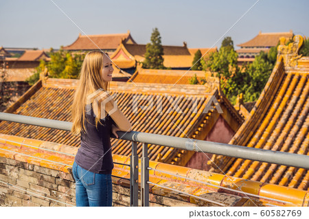 Enjoying vacation in China. Young woman in Forbidden City. Travel to China concept. Visa free transit 72 hours, 144 hours in China 60582769