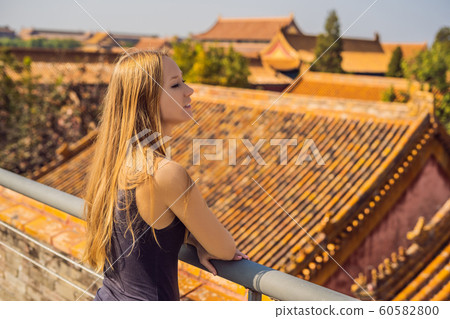 Enjoying vacation in China. Young woman in Forbidden City. Travel to China concept. Visa free transit 72 hours, 144 hours in China 60582800