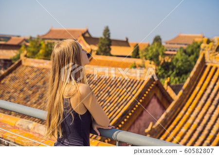 Enjoying vacation in China. Young woman in Forbidden City. Travel to China concept. Visa free transit 72 hours, 144 hours in China 60582807