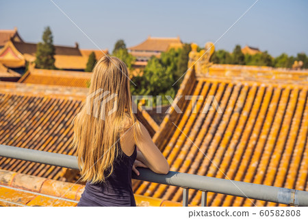 Enjoying vacation in China. Young woman in Forbidden City. Travel to China concept. Visa free transit 72 hours, 144 hours in China 60582808
