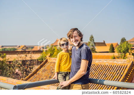 Enjoying vacation in China. Dad and son in Forbidden City. Travel to China with kids concept. Visa free transit 72 hours, 144 hours in China 60582824