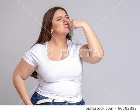Plus Size Model with long hair Grimacing, nose up by singer 60582882